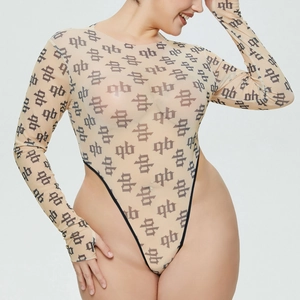Close-up of sheer mesh bodysuit featuring monogram letter prints and long sleeves