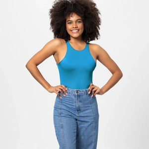 Detail view of bright blue racerback bodysuit paired with decorative seam denim jeans
