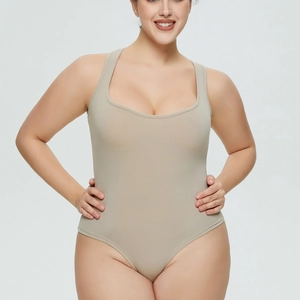 Detail of ribbed beige plus size bodysuit showing high-elastic wide strap U-neck design