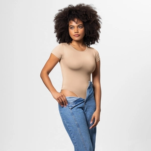 Close-up of beige round-neck bodysuit paired with blue jeans showing high-cut design