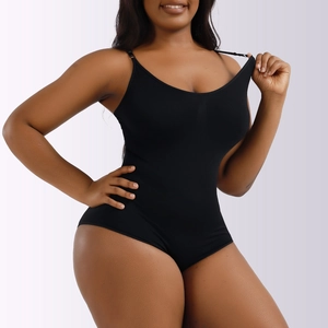 Close-up of black seamless bodysuit featuring elastic fabric and slim straps for shaping
