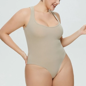 Close-up of the ribbed knit fabric and wide shoulder straps on a khaki bodysuit