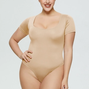 Close-up of nude short sleeve square neck bodysuit with smooth elastic fabric detail