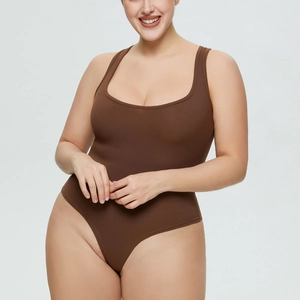 Detailed view of the dark brown ribbed knit fabric and texture of the women bodysuit