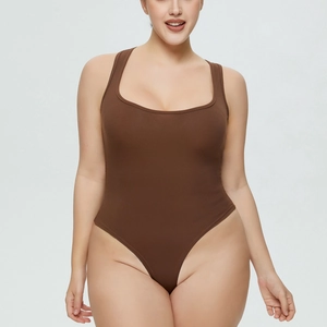 Detail showing the brown ribbed fabric and wide straps of the slim fit bodysuit