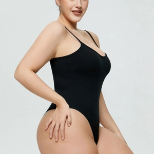 Detail of ribbed knit texture on black slim fit bodysuit with thin spaghetti straps