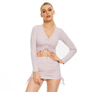 Detail view of light purple drawstring ruched V-neck cropped top and mini skirt set