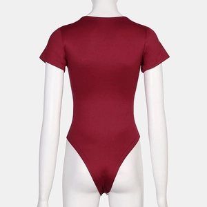 Detail view of burgundy short sleeve bodysuit with square neck and high cut leg design