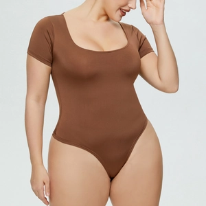 Detailed view of brown bodysuit featuring a deep U-neckline and high-stretch fabric texture