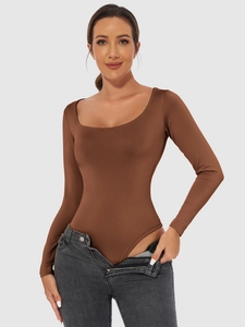 Close-up of slim fit brown bodysuit with elegant square neckline and long sleeves