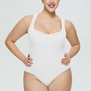 Detail of white ribbed bodysuit featuring square neckline and vertical texture fabric