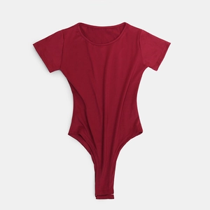 Close-up of wine red short sleeve bodysuit showing snap closure and slim fit fabric