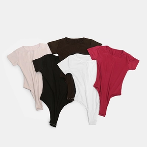 Detail shot of solid color square neck bodysuits with snap closure in five colors