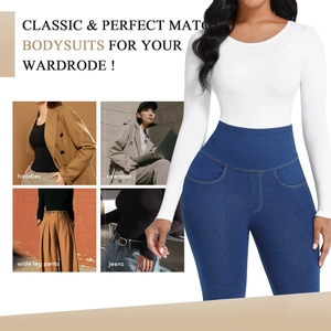Detailed view of a white long sleeve round neck bodysuit styled with denim pants