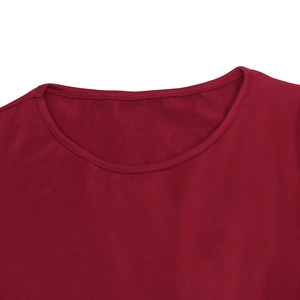 Detail view of the red round neckline with reinforced double-needle stitching and knit fabric