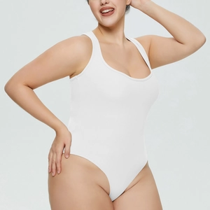 Detail shot of white ribbed bodysuit showing high-cut leg and stretch fabric texture