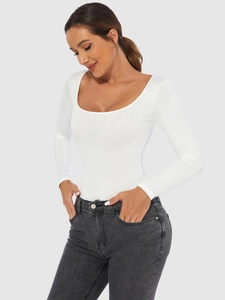 Detail view of white long sleeve bodysuit with a deep U-neckline and slim fit design