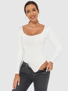 Detail of white long sleeve bodysuit with deep U-neck and elastic slimming fit fabric
