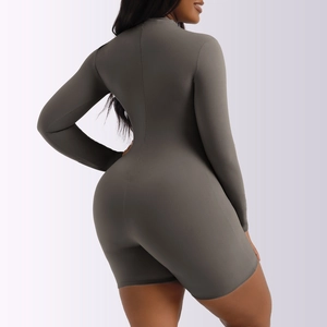Close-up of the grey long-sleeved bodysuit showing high elasticity and soft texture