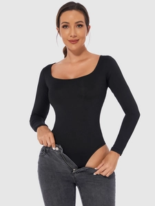 Detail shot of black long sleeve bodysuit with deep U-neckline and slim fit silhouette