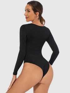 Slim fit long sleeve black bodysuit for women with high-cut design and bodycon silhouette