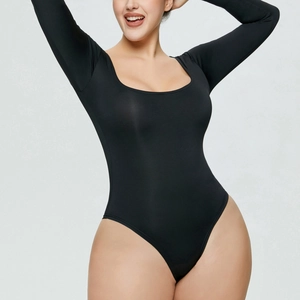 Close-up of sleek black long sleeve bodysuit with deep U-neckline and slim fit design
