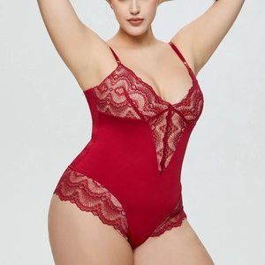 Detail of plus size red lace bodysuit with deep V-neck and floral sheer paneling