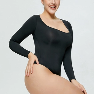 Detail of black long-sleeve bodysuit with deep scoop neck and slimming elastic fit