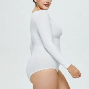 Side view of white long sleeve bodysuit showing slim fit cut and ribbed texture fabric