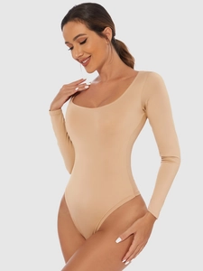 Detail of slim fit beige long sleeve bodysuit with U-neck on model in profile view