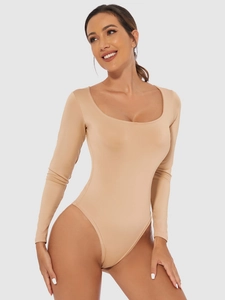 Close-up of nude long sleeve bodysuit with deep round neckline and stretchy slim fit fabric