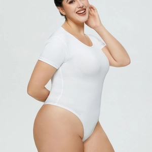 Close-up of a white short sleeve bodysuit showing high-cut leg and elastic fabric detail