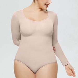 Detailed close-up showing the smooth texture and ergonomic fit of the beige bodysuit