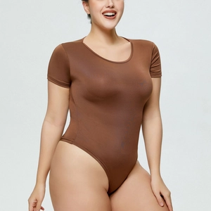 Close-up of brown short sleeve bodysuit showing stretch fabric and high cut fit