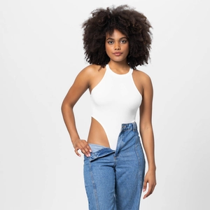 Close-up of white ribbed high neck bodysuit with high-cut design and blue denim jeans