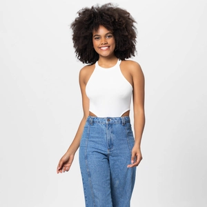 Detailed shot of a ribbed halter bodysuit paired with high-waisted denim jeans