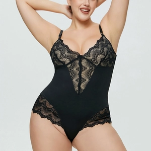 Detail of plus size black bodysuit with delicate floral lace and deep V-neckline texture