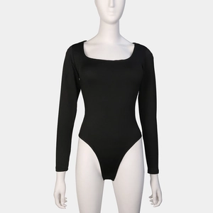 Detail of black long sleeve bodysuit showing slim fit cut and elastic ribbed fabric