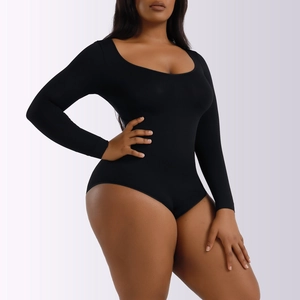 Close-up of black long sleeve bodysuit with deep round neckline and slimming fit