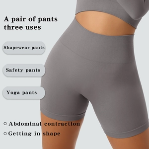 Detail view of the wide ribbed waistband on gray high-waisted seamless shaping shorts