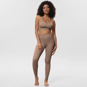Detailed texture of ribbed fabric on khaki seamless sports bra and high-waist yoga pants set
