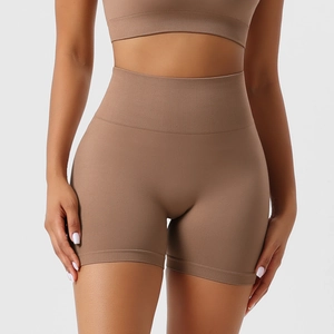 Detail of high-waist seamless coffee shorts featuring wide ribbed waistband and fabric texture