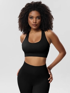 Detail of black seamless ribbed yoga set showing flexible fabric texture and high waist fit