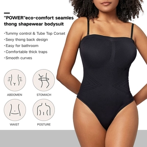 Detail of seamless black shaping bodysuit showing tummy compression and tube top design
