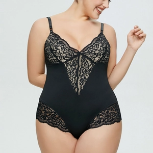 Detailed view of the black plus-size jumpsuit with intricate floral lace and adjustable straps