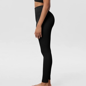 Detailed side view of high-waisted seamless black yoga pants with tummy control and butt lift
