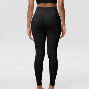 Detail view of high waist seamless yoga leggings featuring back lift design and ribbed texture