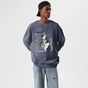 Detail of blue cotton sweatshirt with artistic portrait print and ribbed sleeve cuffs