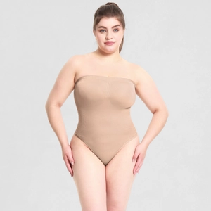 Close-up of seamless ribbed texture on a beige strapless shapewear bodysuit for women
