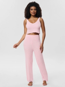 Close-up of pink knit loungewear set featuring soft plush fabric for ultimate comfort
